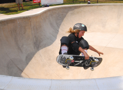 Young person jumping on skateboard