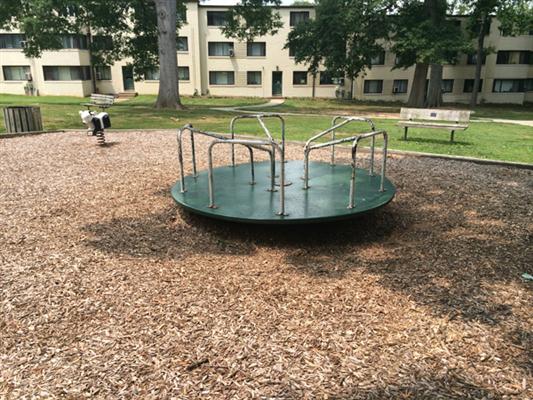 A merry-go-round or roundabout (playground equipment)