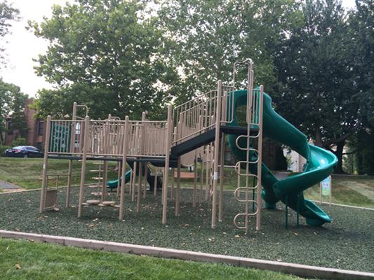 Jungle gym with tall slide